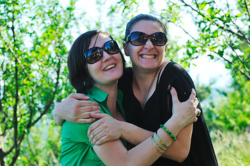 Image showing woman pragnant outdoor with friend