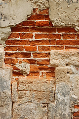 Image showing Old brick masonry with destroyed stucco