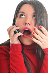 Image showing woman in red talking on cellphone