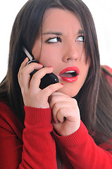 Image showing woman in red talking on cellphone