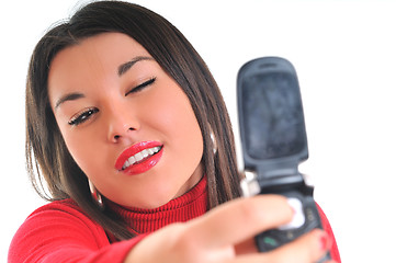 Image showing woman in red talking on cellphone