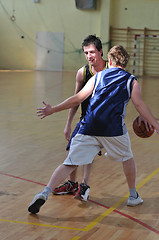 Image showing basketball duel