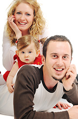 Image showing happy young family together in studio