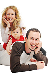 Image showing happy young family together in studio