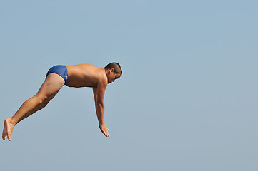 Image showing boy jump sea