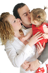 Image showing happy young family together in studio