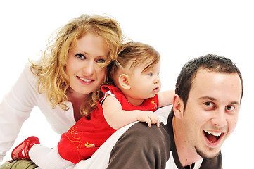 Image showing happy young family together in studio