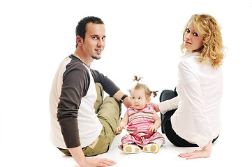 Image showing happy young family together in studio