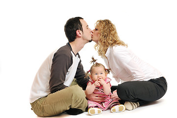 Image showing happy young family together in studio