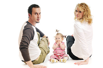 Image showing happy young family together in studio