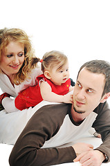 Image showing happy young family together in studio