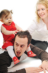 Image showing happy young family together in studio