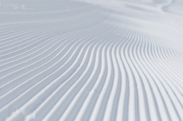 Image showing tracks on ski slopes at beautiful sunny  winter day