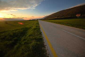 Image showing countryroad adventure with beautiful sunset