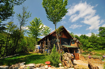 Image showing wooden country house with beutiful garden