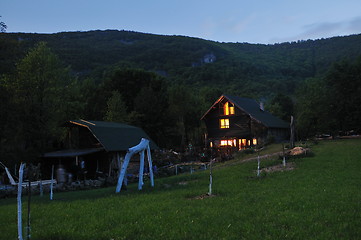 Image showing wooden countryside house in night