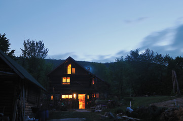 Image showing wooden countryside house in night