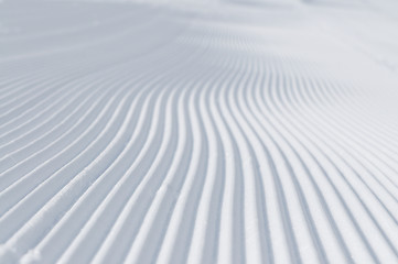 Image showing tracks on ski slopes at beautiful sunny  winter day
