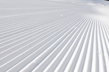 Image showing tracks on ski slopes at beautiful sunny  winter day