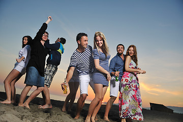 Image showing Group of young people enjoy summer  party at the beach