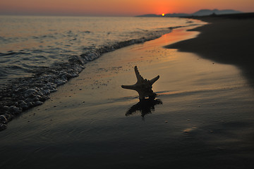 Image showing summer beach sunset with star on beach