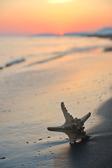 Image showing summer beach sunset with star on beach