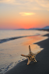 Image showing summer beach sunset with star on beach