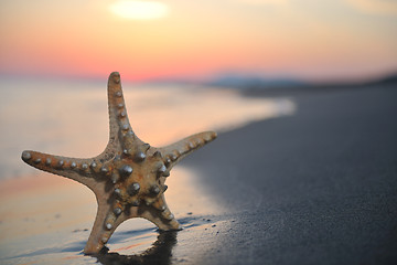 Image showing summer beach sunset with star on beach