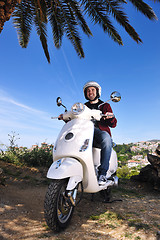 Image showing Portrait of happy young love couple on scooter enjoying summer t