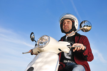 Image showing young man on ride scooter