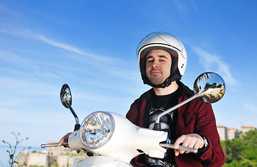 Image showing young man ride retro scooter