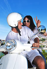 Image showing Portrait of happy young love couple on scooter enjoying summer t