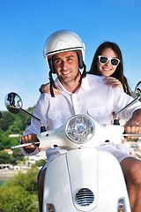 Image showing Portrait of happy young love couple on scooter enjoying summer t