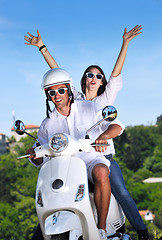 Image showing Portrait of happy young love couple on scooter enjoying summer t