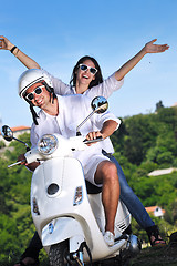 Image showing Portrait of happy young love couple on scooter enjoying summer t