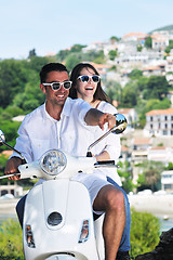 Image showing Portrait of happy young love couple on scooter enjoying summer t