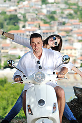 Image showing Portrait of happy young love couple on scooter enjoying summer t