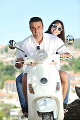 Image showing Portrait of happy young love couple on scooter enjoying summer t