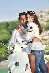 Image showing Portrait of happy young love couple on scooter enjoying summer t