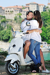 Image showing Portrait of happy young love couple on scooter enjoying summer t