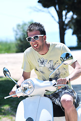 Image showing young man ride retro scooter