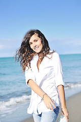 Image showing happy young woman on beach