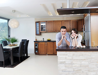 Image showing happy young couple have fun in modern kitchen