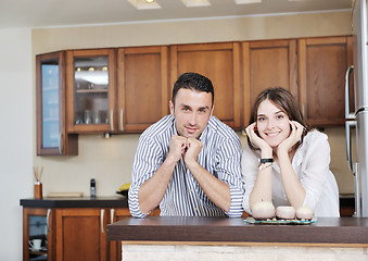 Image showing happy young couple have fun in modern kitchen
