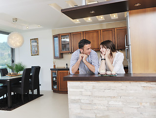 Image showing happy young couple have fun in modern kitchen