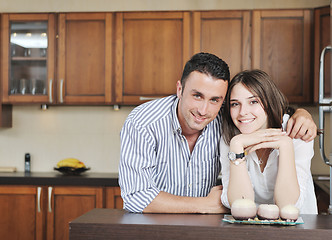 Image showing happy young couple have fun in modern kitchen