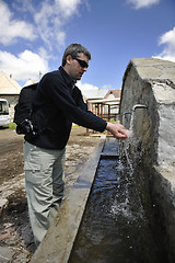 Image showing fresh mountain water falling on hands