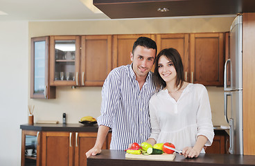 Image showing happy young couple have fun in modern kitchen