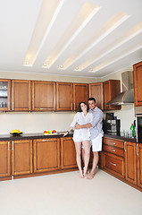 Image showing happy young couple have fun in modern kitchen