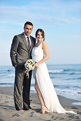 Image showing romantic beach wedding at sunset